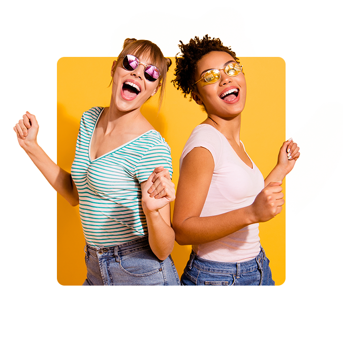 Two women dancing against a yellow background