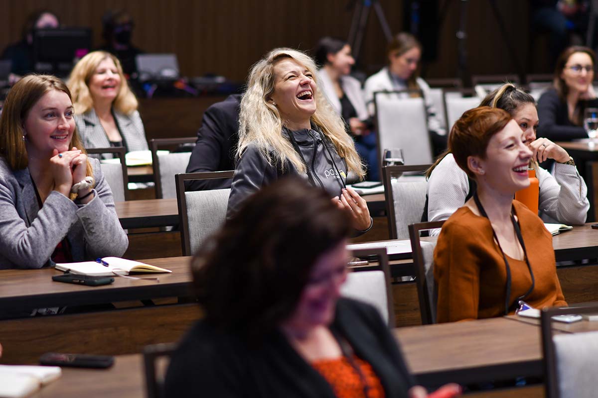 A room full of laughing marketers at a MarketingProfs' workshop